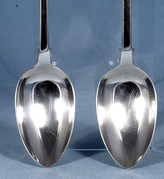 A pair of William IV silver fiddle pattern serving spoons and a similar Victorian pair, Length 237mm, weight 4.9oz/153grms